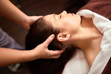 Image showing woman having head massage at spa