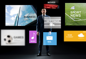 Image showing businessman with virtual applications