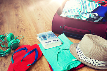 Image showing close up of travel bag with clothes and stuff