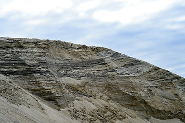 Image showing Sandy hill in a quarry against the sky