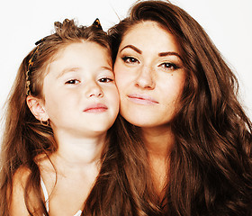 Image showing young mother with little cute daughter emotional posing on white