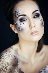 Image showing fashion portrait of pretty young woman with creative make up lik