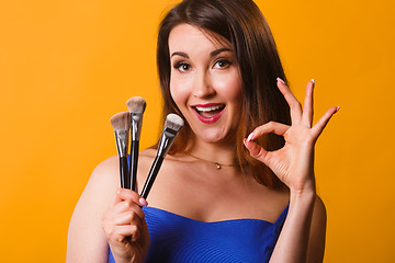 Image showing Photo of girl with brushes