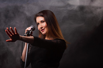 Image showing Studio photo of singing woman