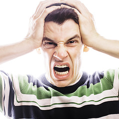 Image showing Portrait of a smart serious young man standing against white bac