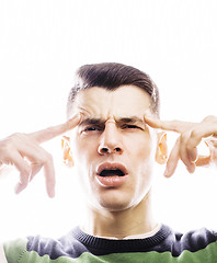 Image showing Portrait of a smart serious young man standing against white bac