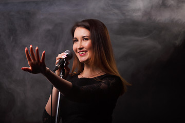 Image showing Studio photo of singing brunette