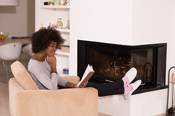 Image showing black woman at home reading book