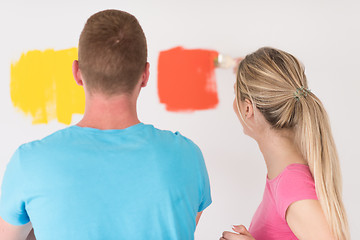 Image showing couple painting interior wall