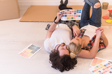 Image showing Happy young couple relaxing after painting