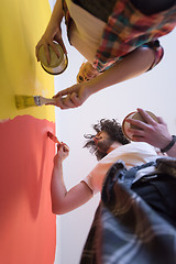 Image showing couple painting interior wall