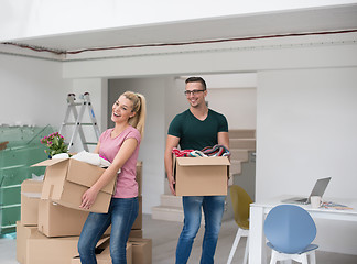 Image showing young couple moving into a new home