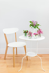 Image showing Elegant interior with table, chair and spring flowers