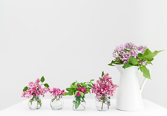 Image showing Vases with pink and purple spring flowers