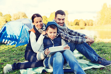 Image showing happy family with tablet pc and tent at camp site