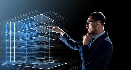 Image showing businessman in glasses with virtual building 