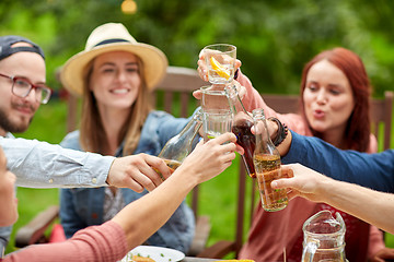 Image showing happy friends with drinks at summer garden party