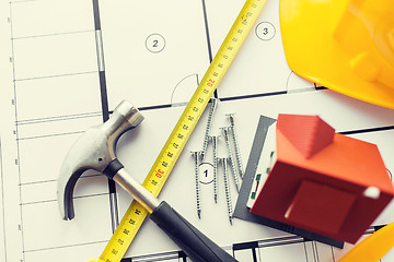 Image showing close up of house blueprint with building tools