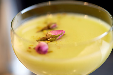 Image showing close up of glass with creamy cocktail at bar