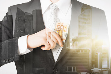 Image showing close up of businessman with euro money