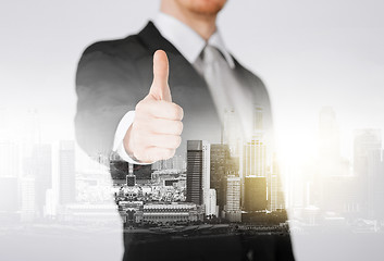 Image showing businessman showing thumbs up