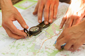 Image showing Navigating with map and compass