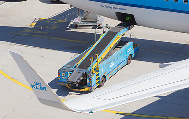 Image showing AMSTERDAM, NETHERLANDS - AUGUST 17, 2016: Loading luggage in air