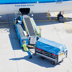 Image showing AMSTERDAM, NETHERLANDS - AUGUST 17, 2016: Loading luggage in air