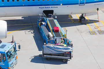 Image showing AMSTERDAM, NETHERLANDS - AUGUST 17, 2016: Loading luggage in air