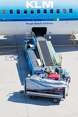 Image showing AMSTERDAM, NETHERLANDS - AUGUST 17, 2016: Loading luggage in air