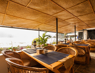 Image showing Tables at a cafe next to lake