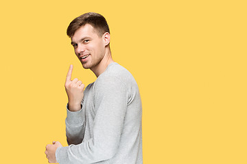 Image showing The young man smiling and looking at camera