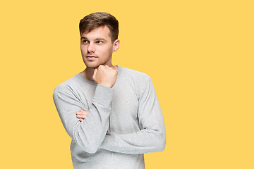 Image showing The young man smiling and looking away