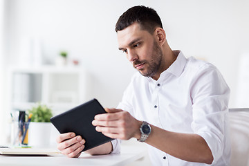 Image showing businessman with tablet pc at office