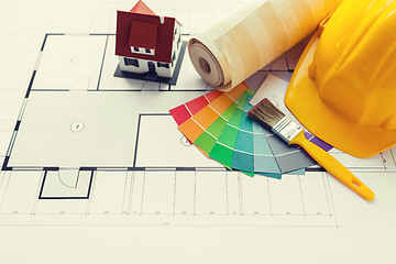 Image showing close up of house blueprint with building tools