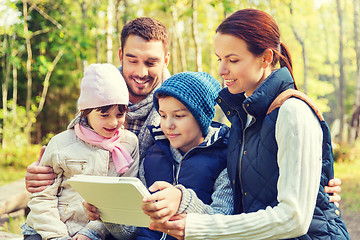 Image showing happy family with tablet pc at camp