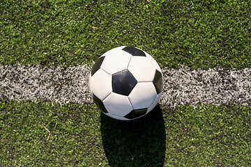 Image showing soccer ball on football field marking line