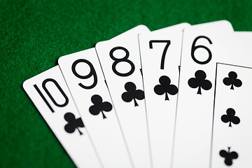 Image showing poker hand of playing cards on green casino cloth