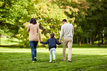 Image showing happy family walking in summer park