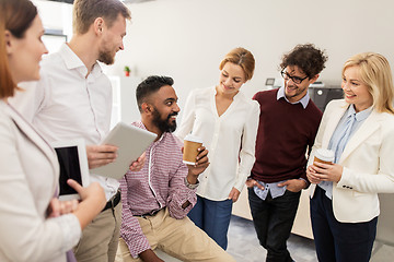 Image showing happy business team drinking coffee at office