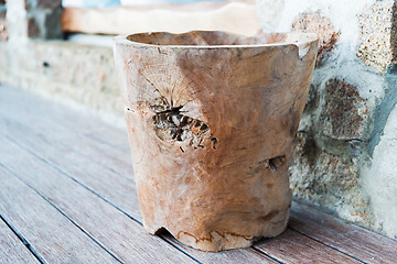 Image showing outdoor wooden bowl or vase on terrace floor