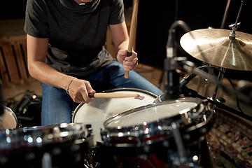 Image showing male musician playing drums and cymbals at concert