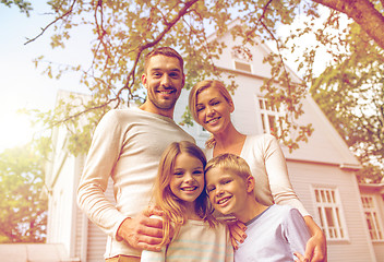 Image showing happy family in front of house outdoors