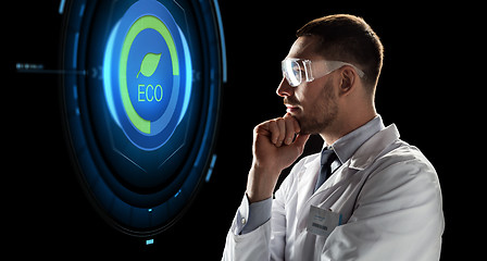 Image showing scientist in goggles looking at virtual projection