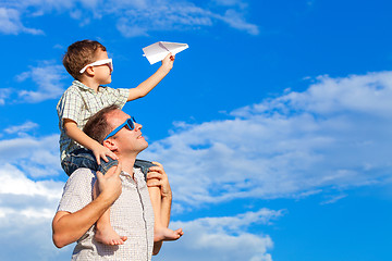 Image showing Father and son playing in the park  at the day time.