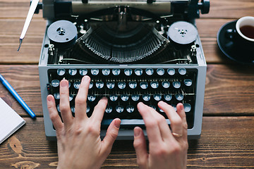 Image showing Crop person using typewriter