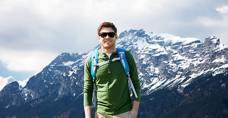 Image showing happy man with backpack traveling in highlands