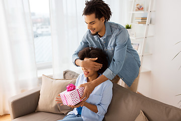 Image showing happy couple with gift box at home