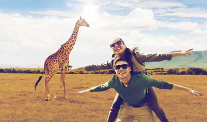 Image showing happy couple with backpacks having fun in africa