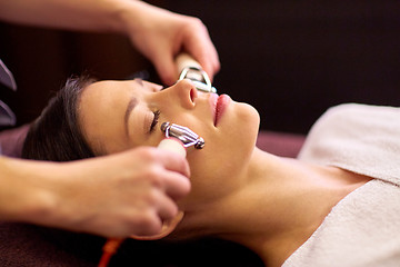 Image showing woman having hydradermie facial treatment in spa